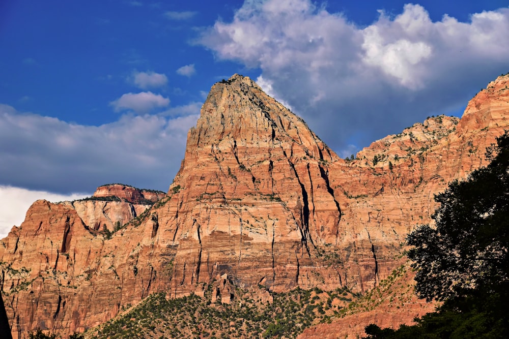 a large mountain with a sky background