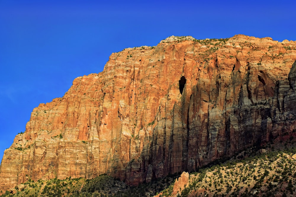 a tall mountain with a sky in the background