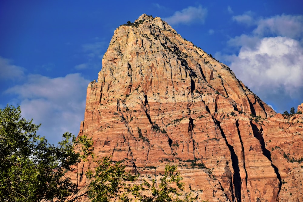 a very tall mountain with a sky in the background