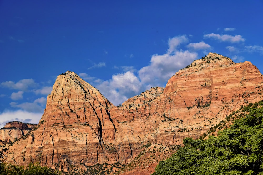 a large mountain with a sky in the background