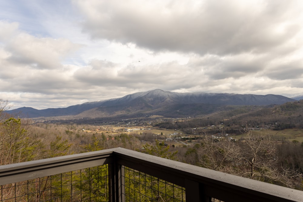 a balcony with a view of the mountains
