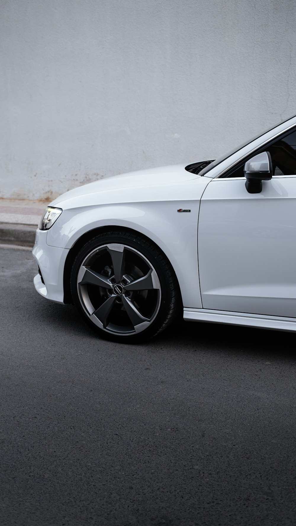 a white car parked on the side of the road