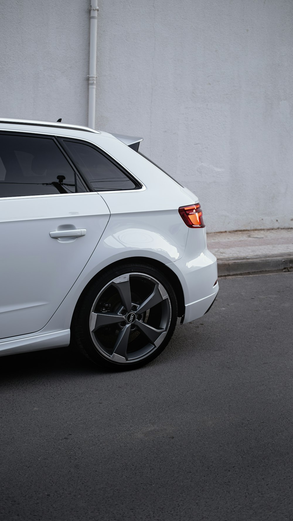 a white car parked on the side of the road