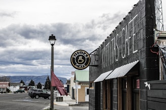 a black building with a clock on the front of it