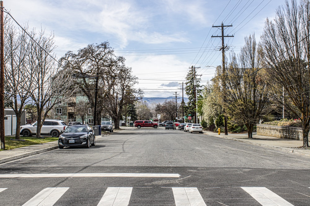 a street with cars parked on both sides of it