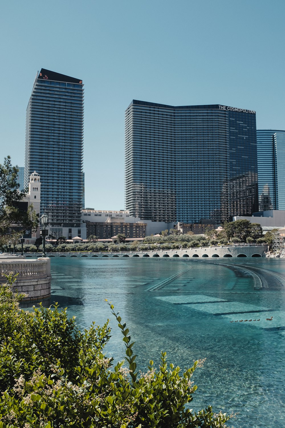 a body of water surrounded by tall buildings