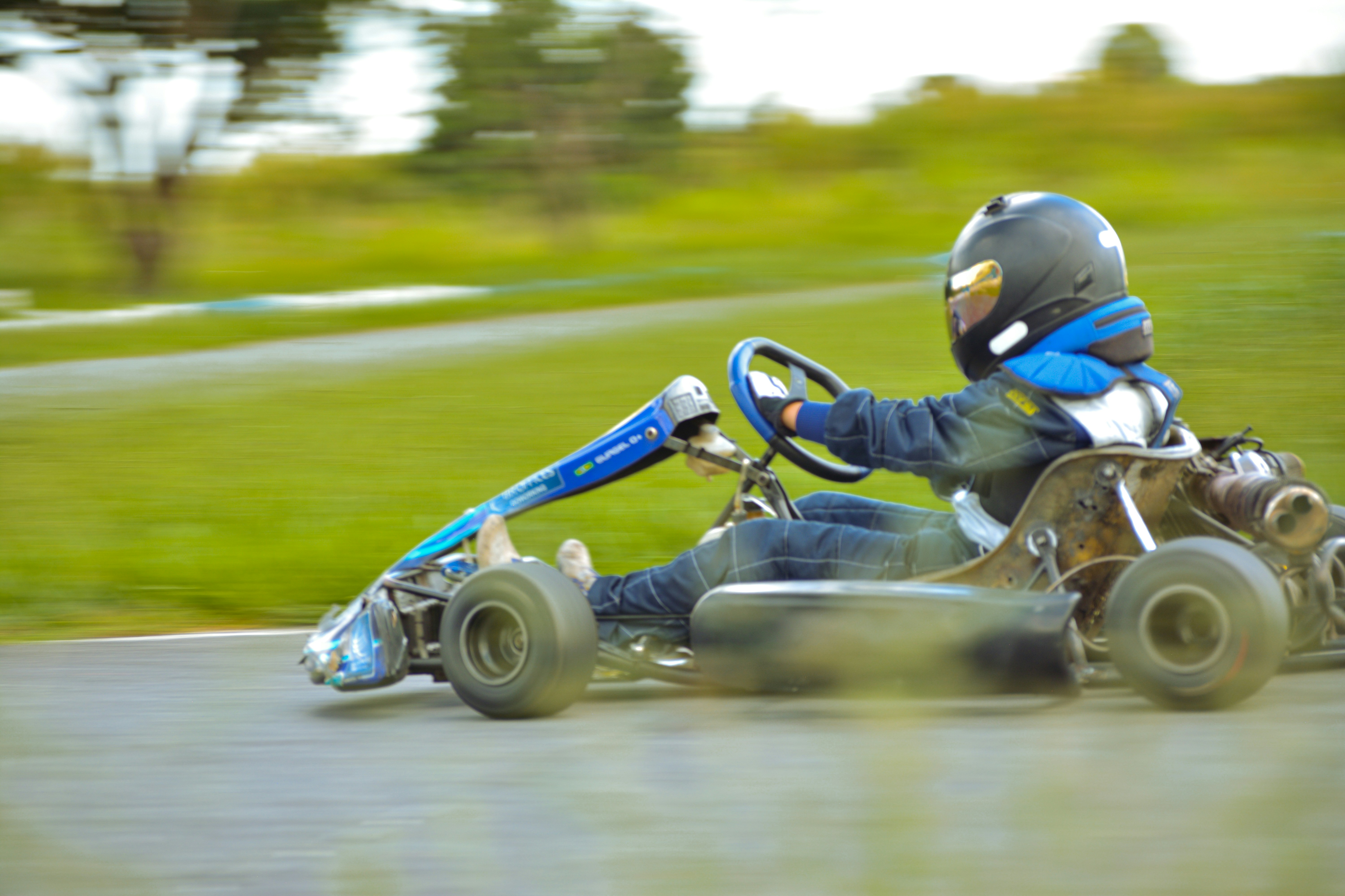 a person riding a go kart on a road
