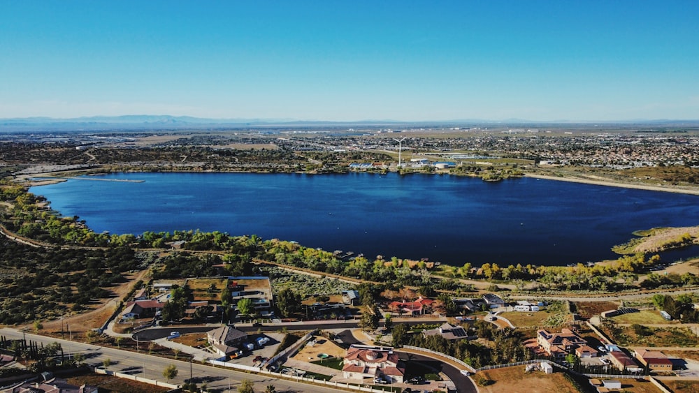 an aerial view of a lake surrounded by trees