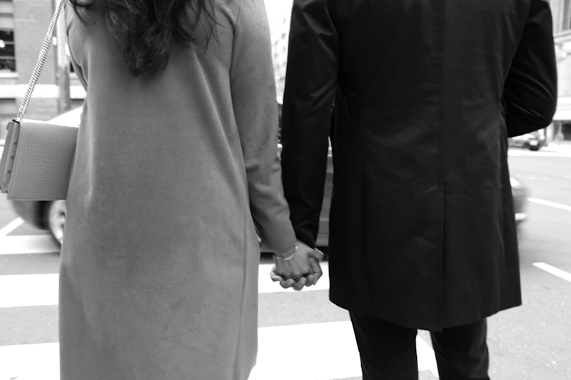 black and white photo of a couple holding hands