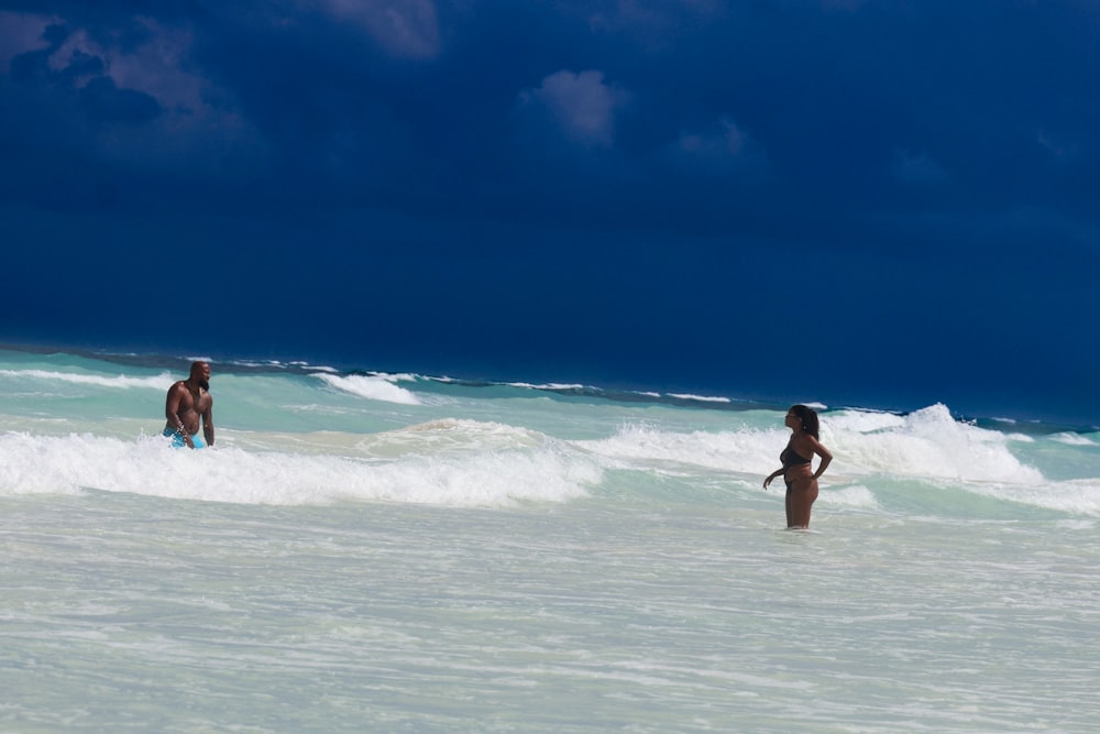 a couple of people that are in the water