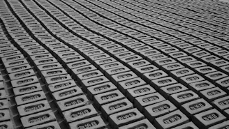 a black and white photo of rows of cell phones