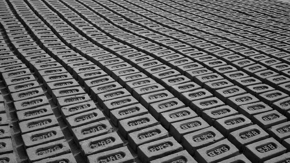 a black and white photo of rows of cell phones