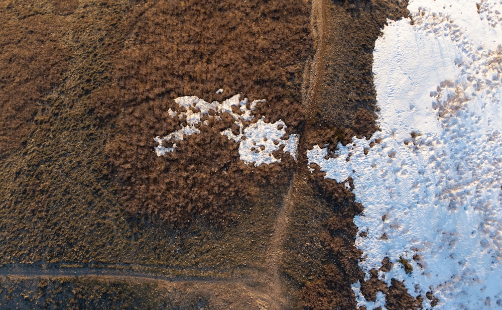 a bird's eye view of a snow covered field