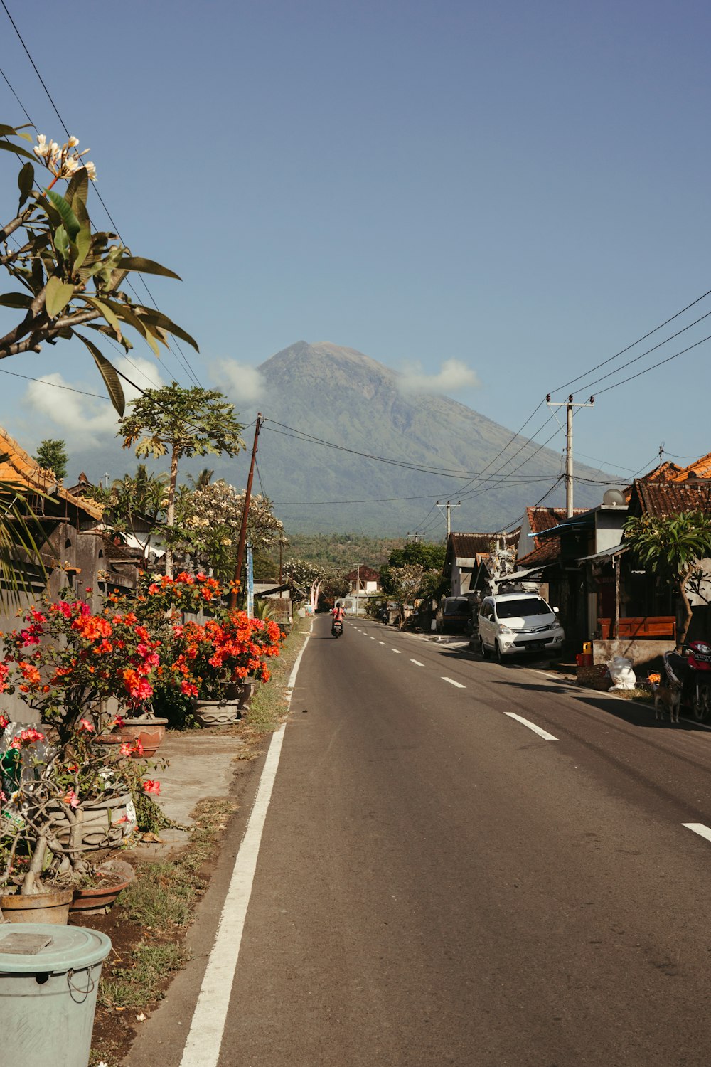 a street with a mountain in the background