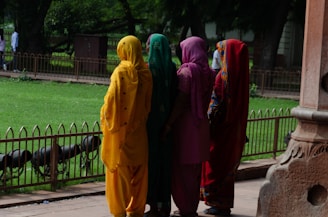 a group of people in colorful outfits standing next to each other