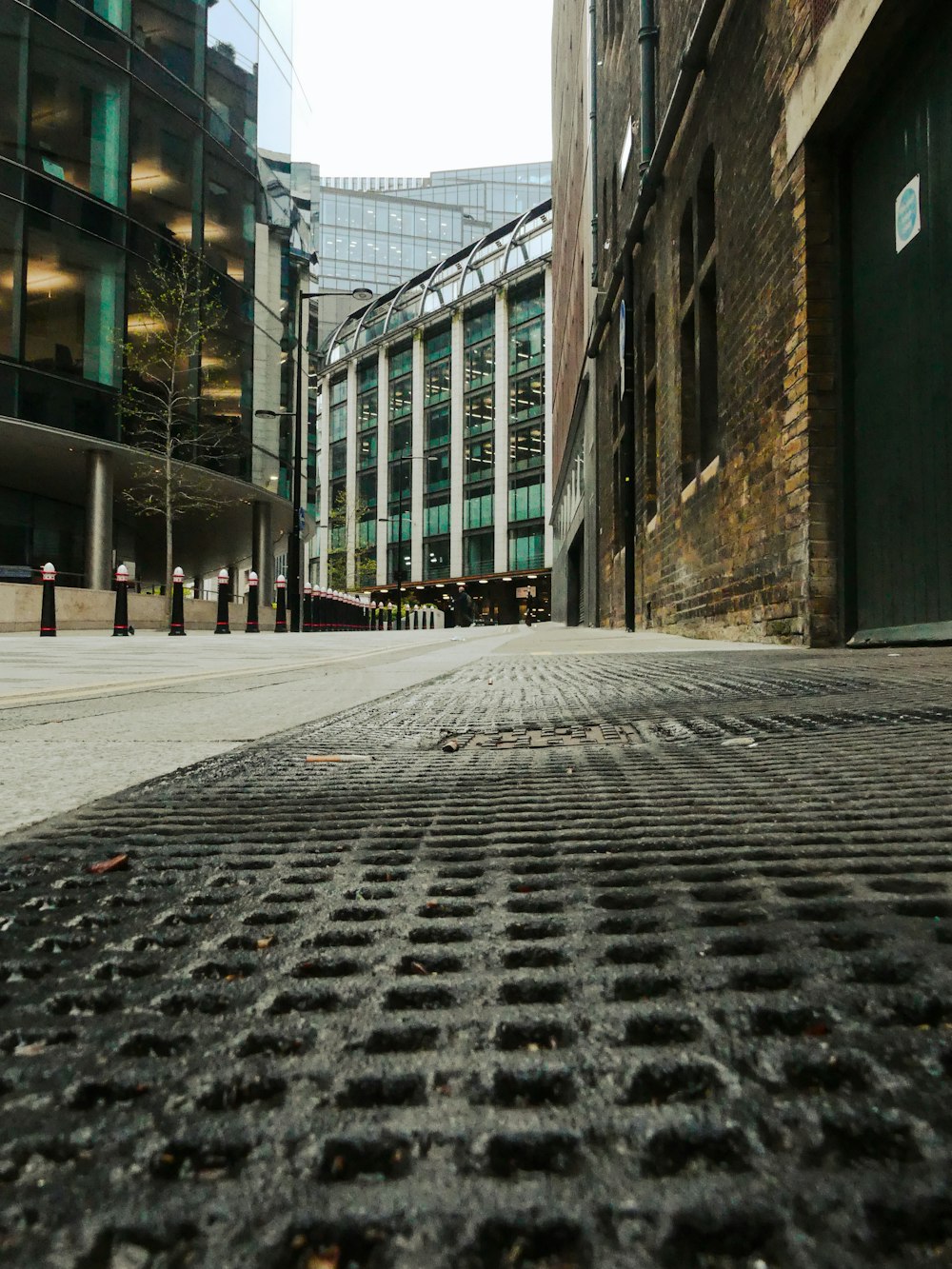 a manhole cover in the middle of a city street