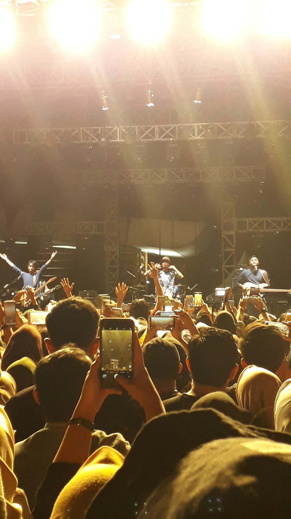 a group of people standing in front of a stage