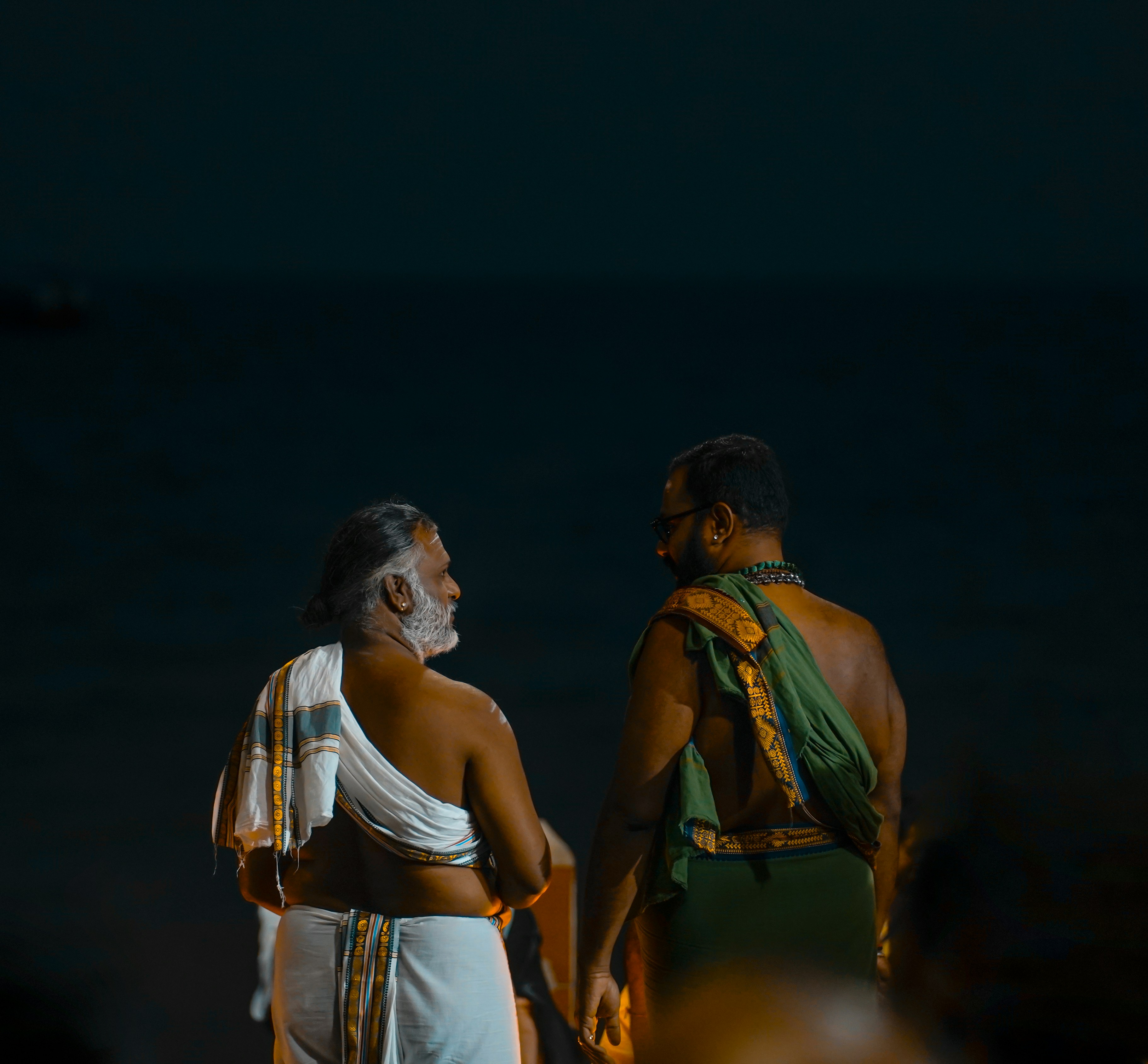 a couple of men standing next to each other