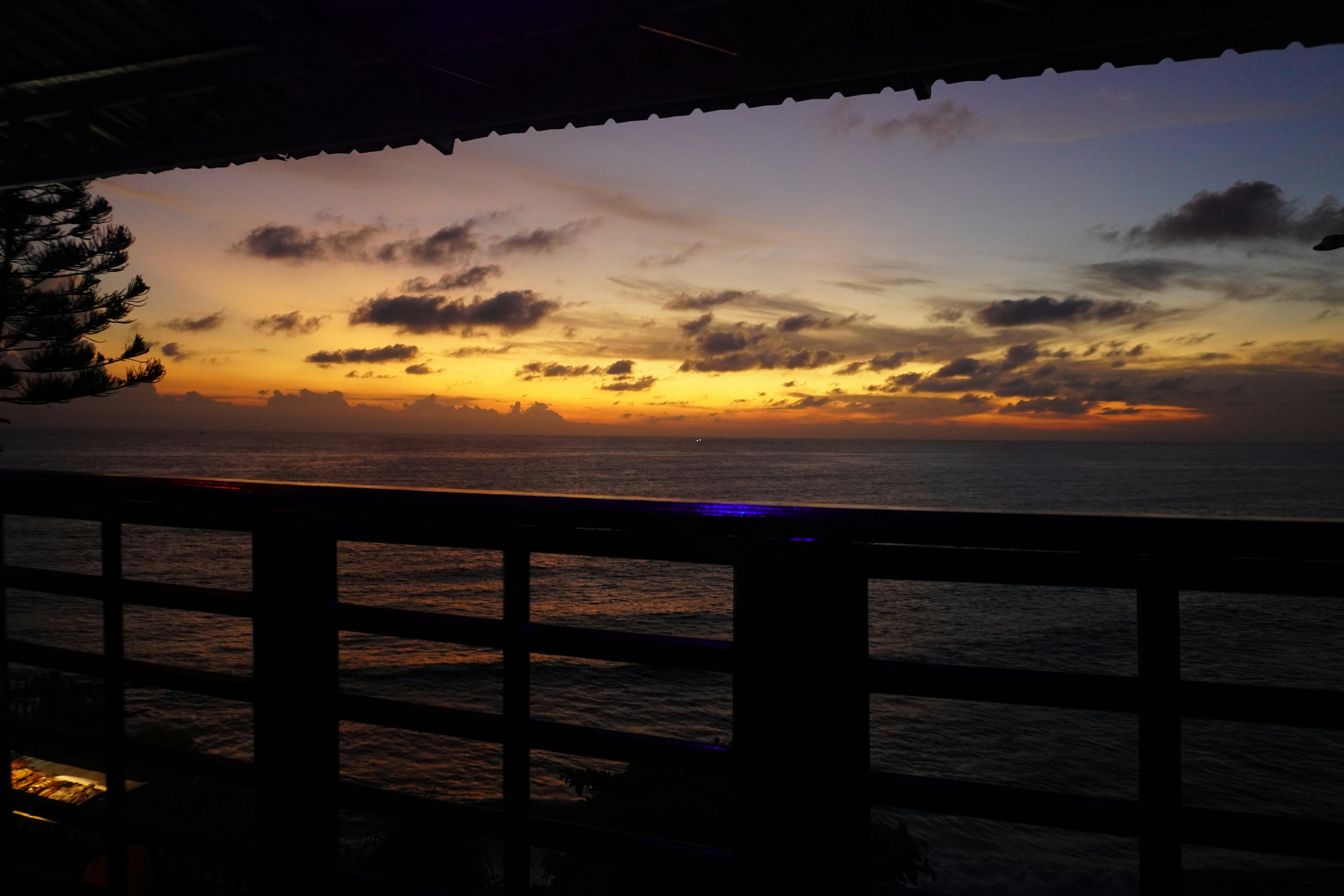 rooftop table overlooking the ocean at sunset - rooftop dining san diego