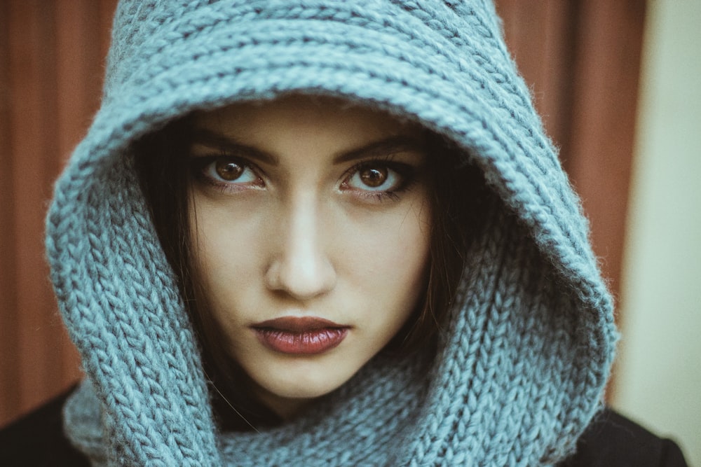 a woman wearing a blue scarf around her head