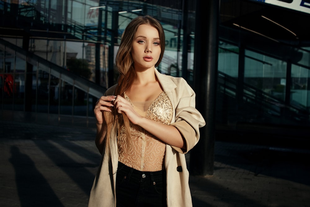 a woman standing in front of a building