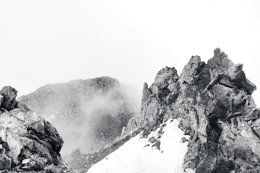 a black and white photo of a mountain range