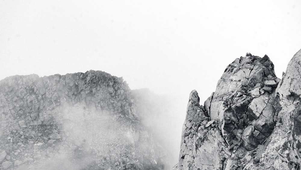 a black and white photo of a mountain peak