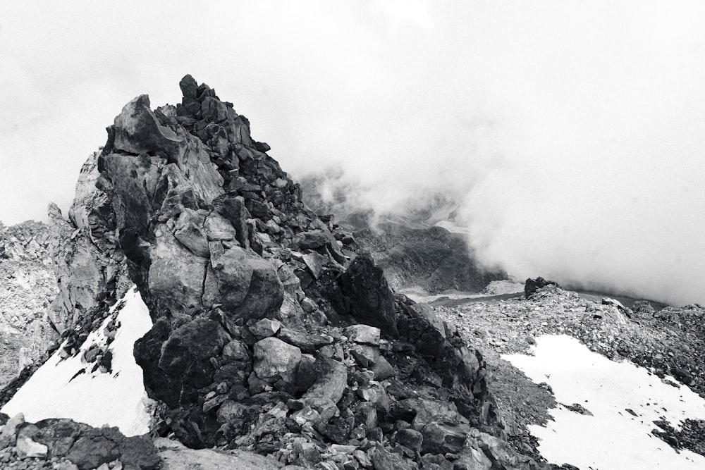 a black and white photo of a rocky mountain