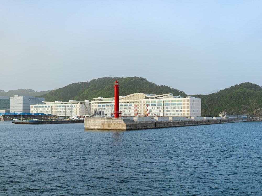 a large body of water with buildings in the background