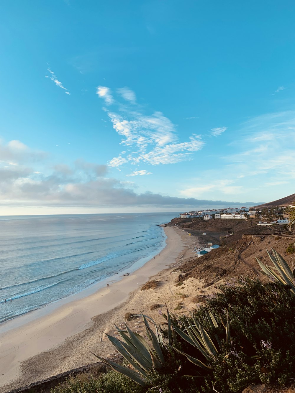 a view of a beach from a hill