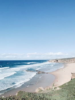 a view of a beach from a hill