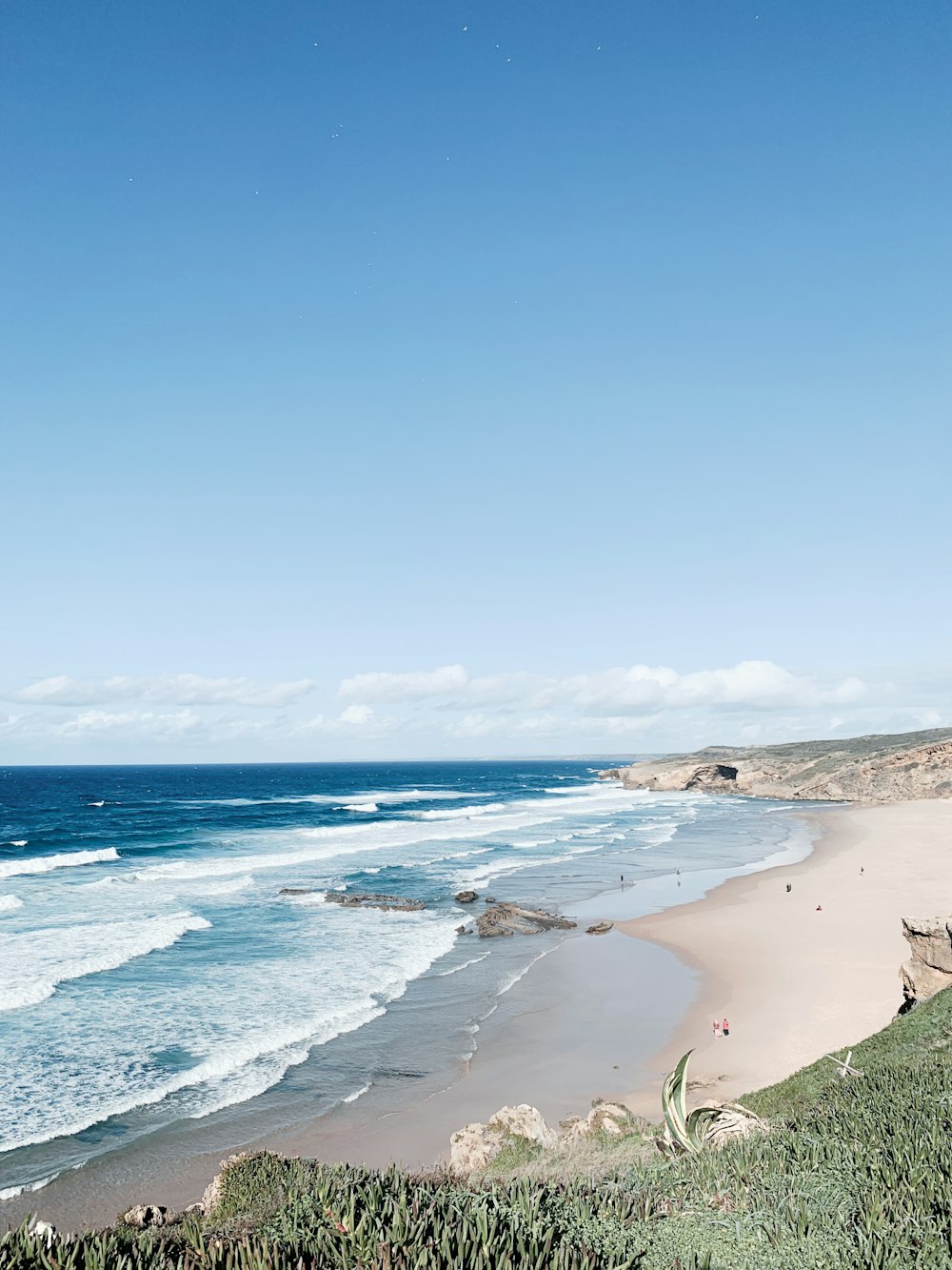 a view of a beach from a hill