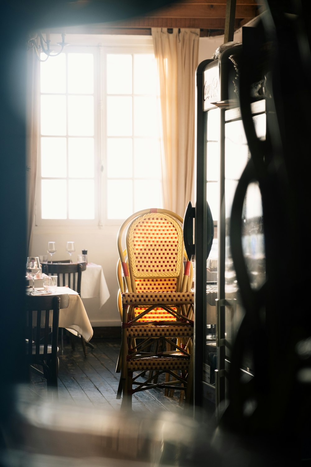 a chair and table in a room with a window