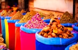 a variety of colorful bags filled with different types of spices