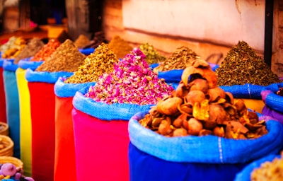 a variety of colorful bags filled with different types of spices