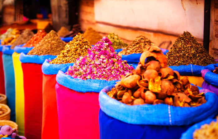 Cones of colorful ground spices for sale in a Marrakech souk