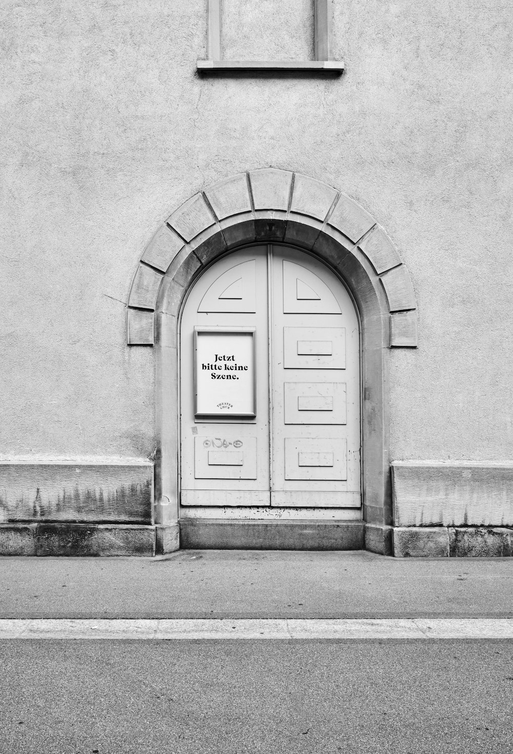 a black and white photo of an entrance to a building