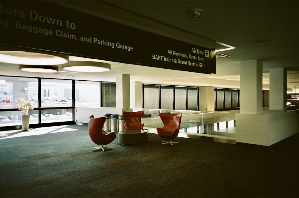 a large room with two chairs and a table