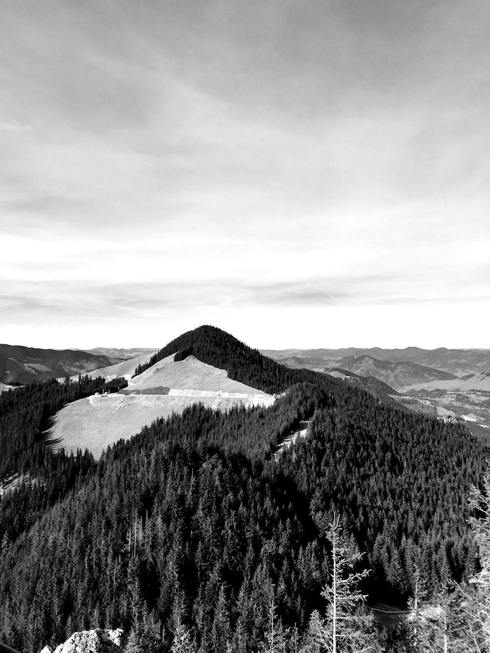 a black and white photo of a mountain range