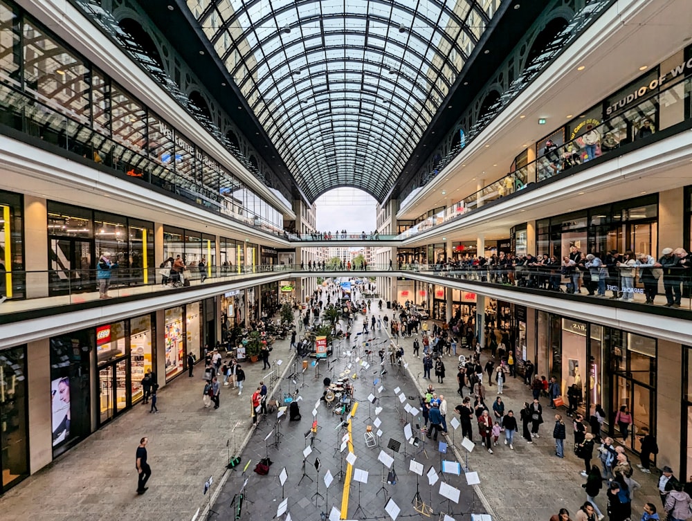 a mall filled with lots of people walking around