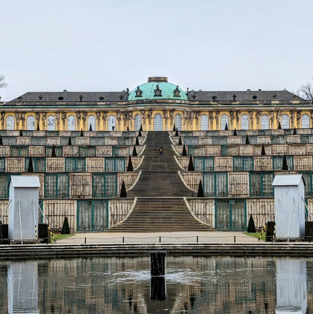 a large building with a fountain in front of it