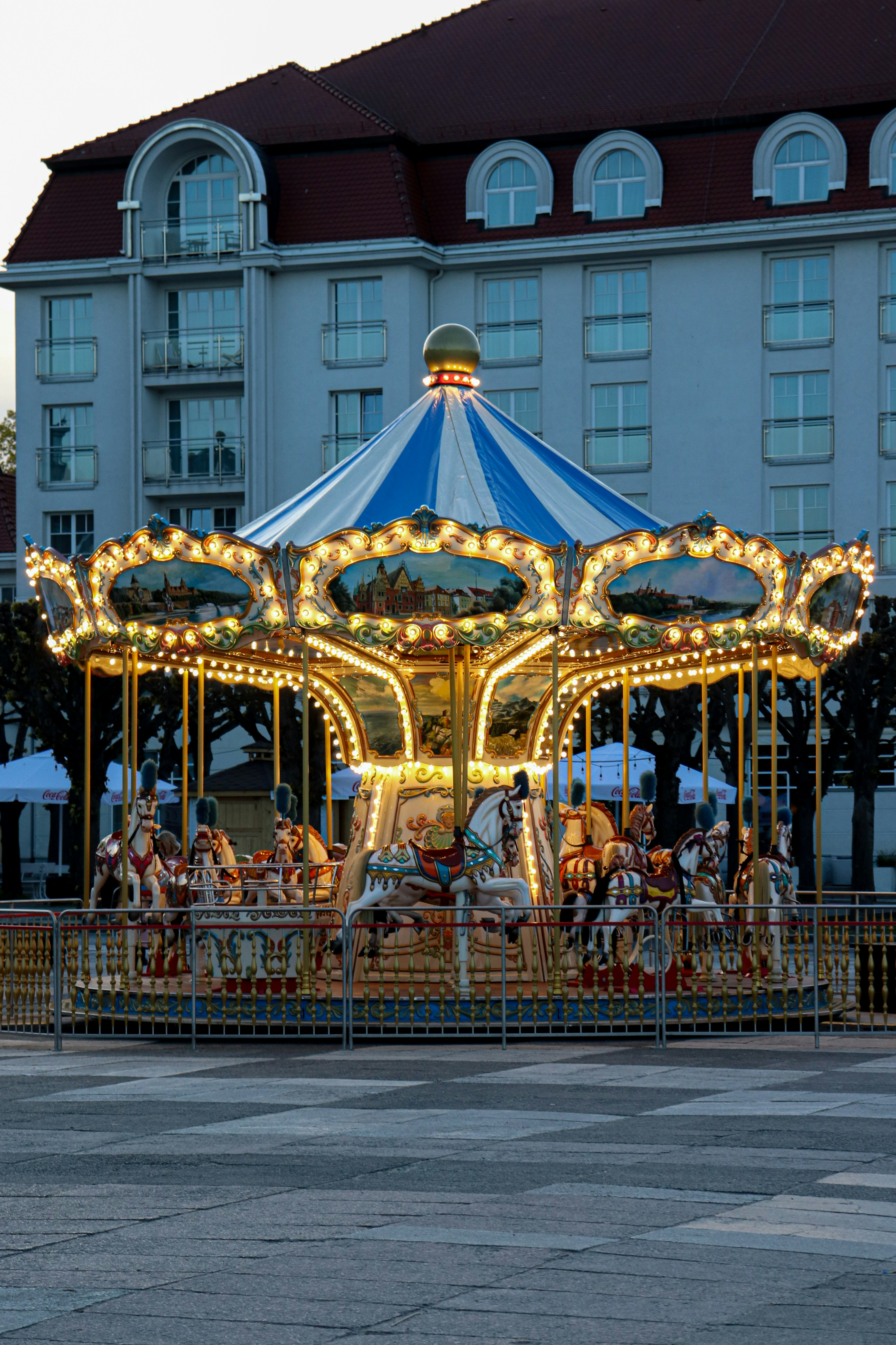 a merry go round in front of a large building