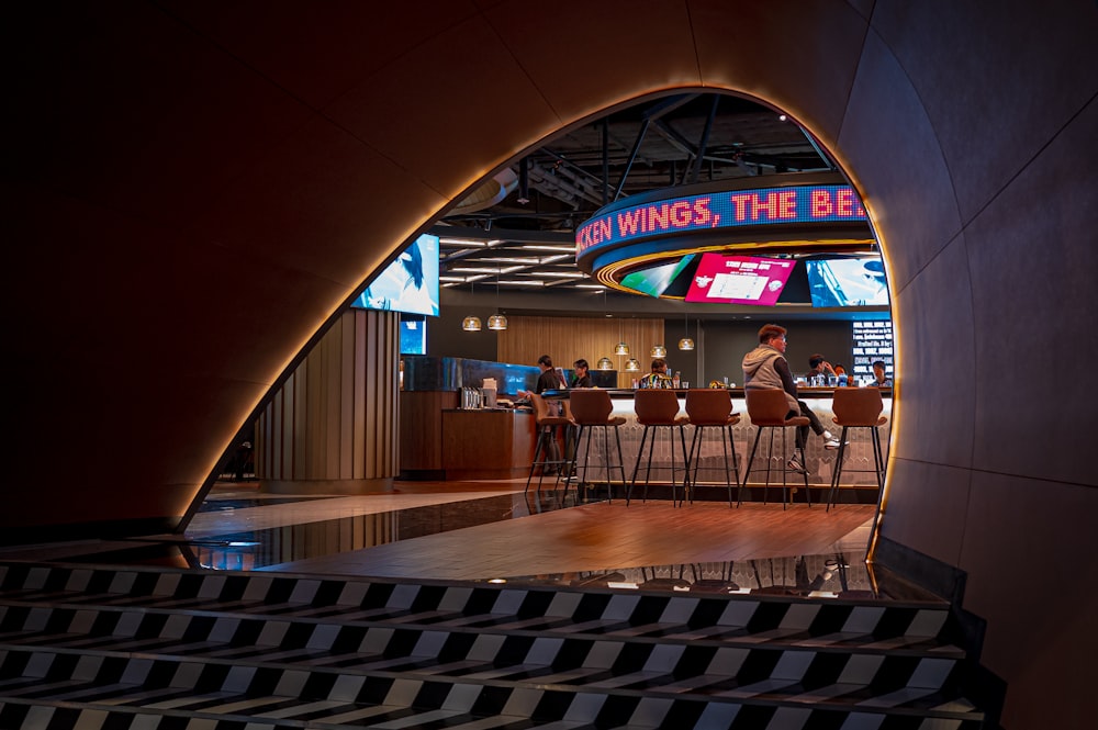 a man sitting at a bar in a building