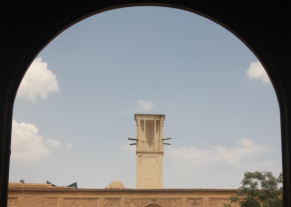 a tall clock tower towering over a city