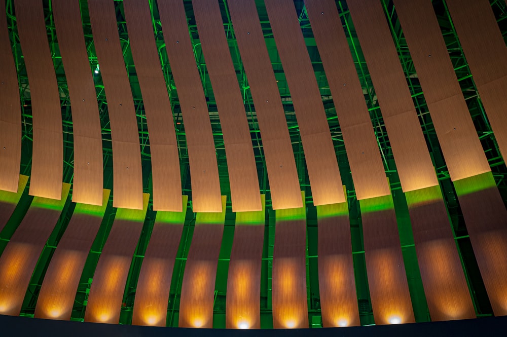 the ceiling of a concert hall with green and yellow lights