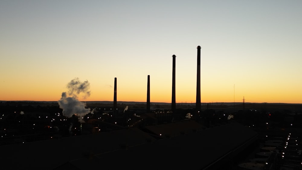 a factory with a lot of smoke coming out of it