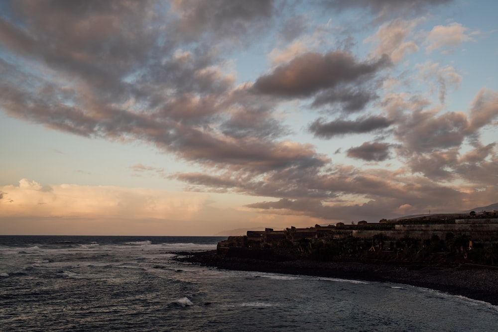 a view of a body of water at sunset