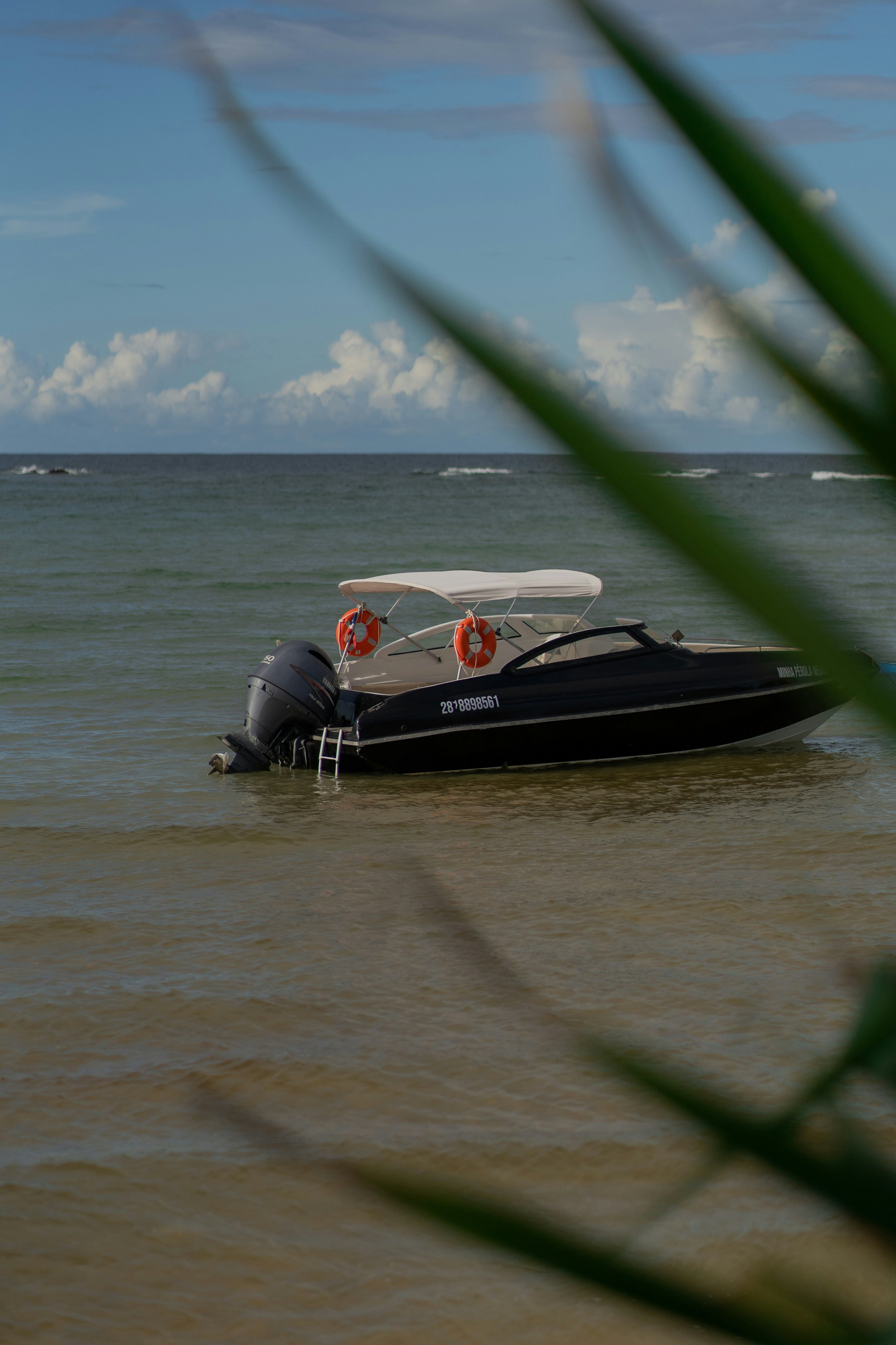A small boat in the middle of a body of water photo – Free Grey Image ...