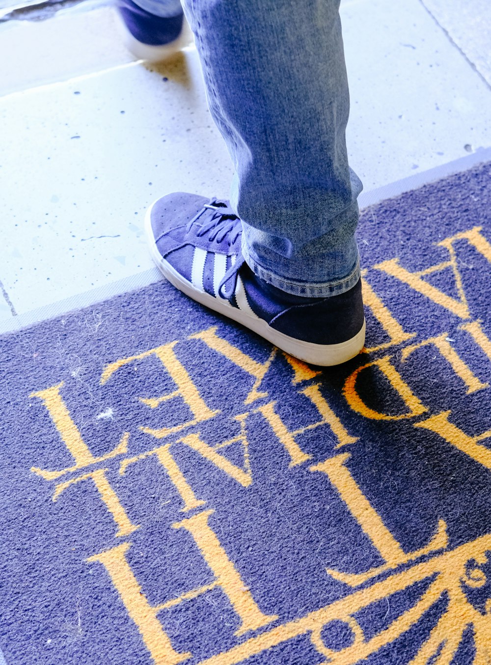 a close up of a person standing on a skateboard