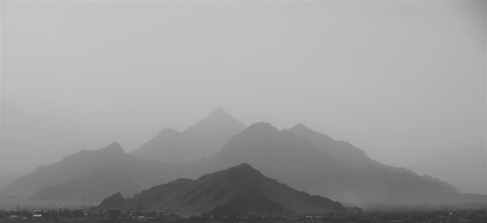 a black and white photo of a mountain range